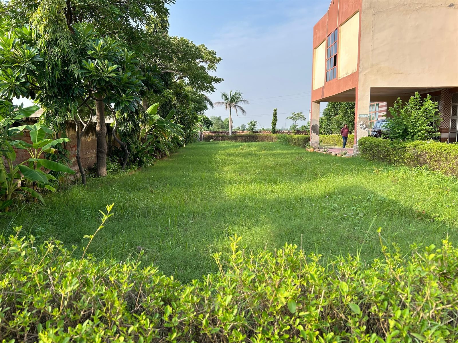 SRCM College Agra campus building surrounded by green lawns